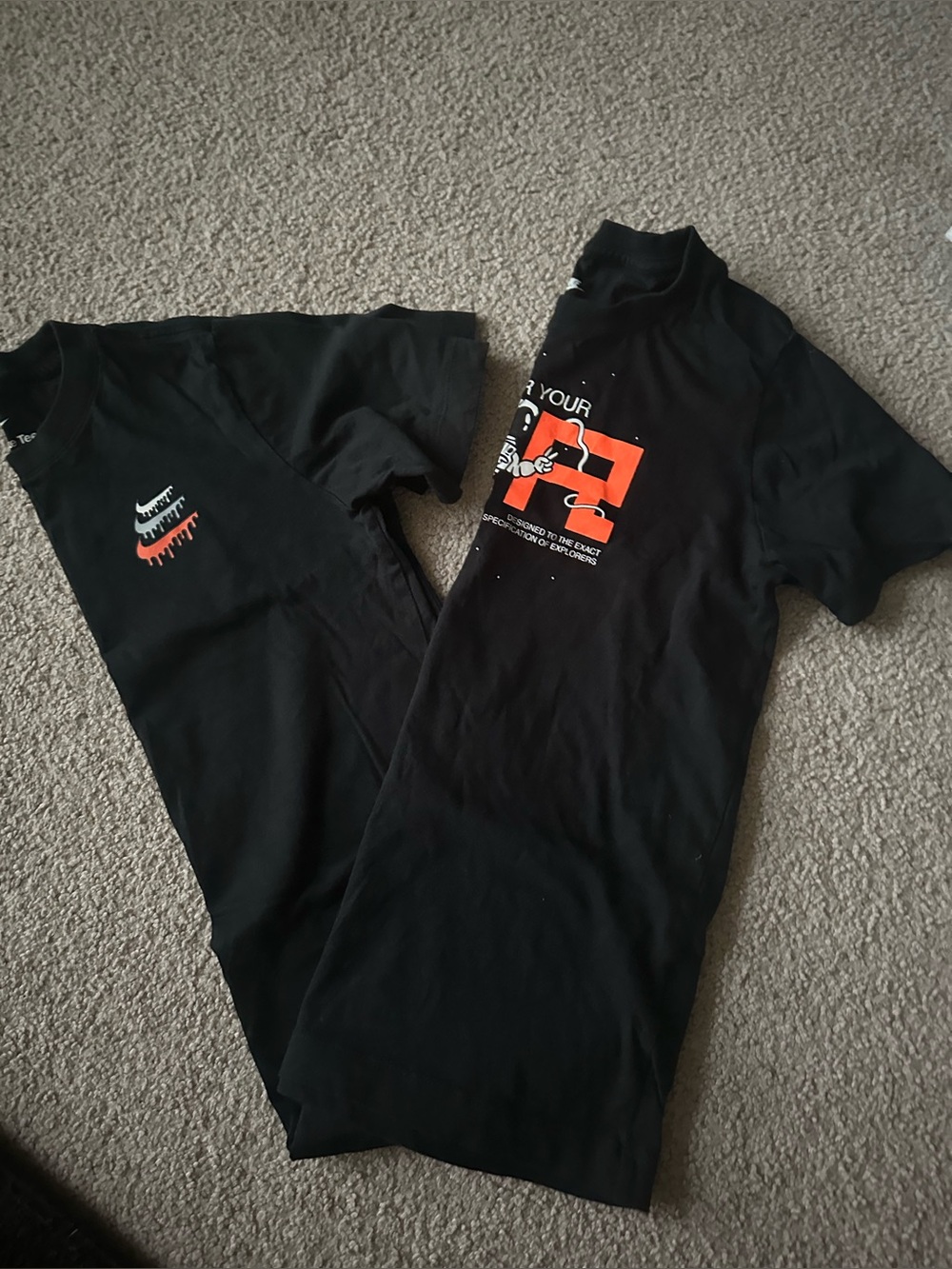 Two Nike Graphic Tees. Youth size Medium (8-10).